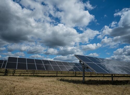 solar-panels-used-renewable-energy-field-sky-full-clouds